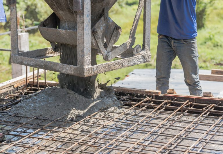 worker-open-cement-bucket-tank-machine-on-fence-fr-2026-01-07-05-39-18-utc-scaled.jpg
